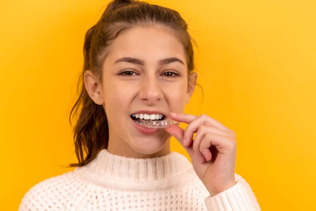 braces for adults smiling confidently with straight white teeth