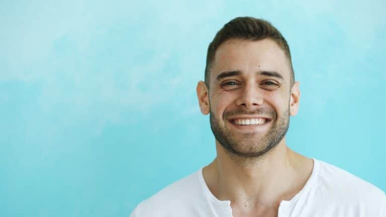 confident adult smiling with straight white teeth